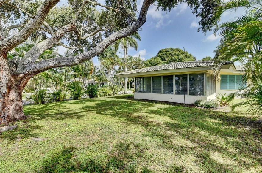 DREAM OPPORTUNITY! SITUATED ON THE MOST PICTURESQUE POINT CORNER LOT IN DESIRABLE LAKE IDA, THIS CHARMING ORIGINAL MID-CENTURY MODERN-STYLE 3BED/3BATH/1CG SINGLE STORY OF ALMOST 2600 SF/AC, WITH BEAUTIFUL TERRAZZO FLOORING & PATTERNED TILE, HAS ENDLESS POSSIBILITIES FOR AN AMAZING RENOVATION! LIGHT & BRIGHT, WITH A CIRCULAR WALL OF WINDOWS THAT OVERLOOK THE PARK-LIKE GARDEN OF OVER QUARTER ACRE, WHICH IS CENTERED BY A MAGNIFICENT OAK TREE! THE SPACIOUS DESIGN & OPEN FLOOR PLAN AWAITS A NEW CREATIVE TRANSFORMATION! ONE OF LARGEST SQ FT SINGLE STORY AVAIL IN AREA, THIS UNIQUE 10,000SF+ LOT HAS A LARGE CIRCULAR DRIVE FRONTING ENFIELD. MINUTES FROM DOWNTOWN TRENDY ATLANTIC AVE W/RESTAURANTS, OUTDOOR CAFES & SHOPS, WITH THE INTRACOASTAL WATERWAYS & SANDY BEACHES JUST A BIT FURTHER EAST.