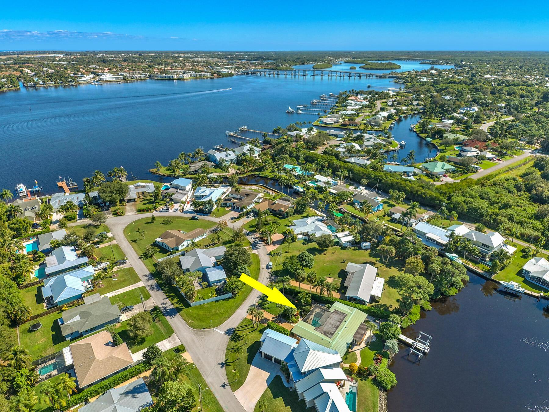 Waterfront Oasis. Located in Pelican Cove, a small cul-de-sac community providing all of the waterfront amenities & privacy. This CBS pool home offers the ideal location nestled in a private deep water lagoon with no fixed bridges to open ocean access! The lush ,tropical landscaping in both the front and back yard is the epitome of the Florida lifestyle. NO HOA. Boat to downtown Stuart waterfront in just a few minutes or enjoy open ocean fishing. Property offers a walk out dock with water & electric as well as 2 boat lifts. Available for summer & upcoming 2026 season