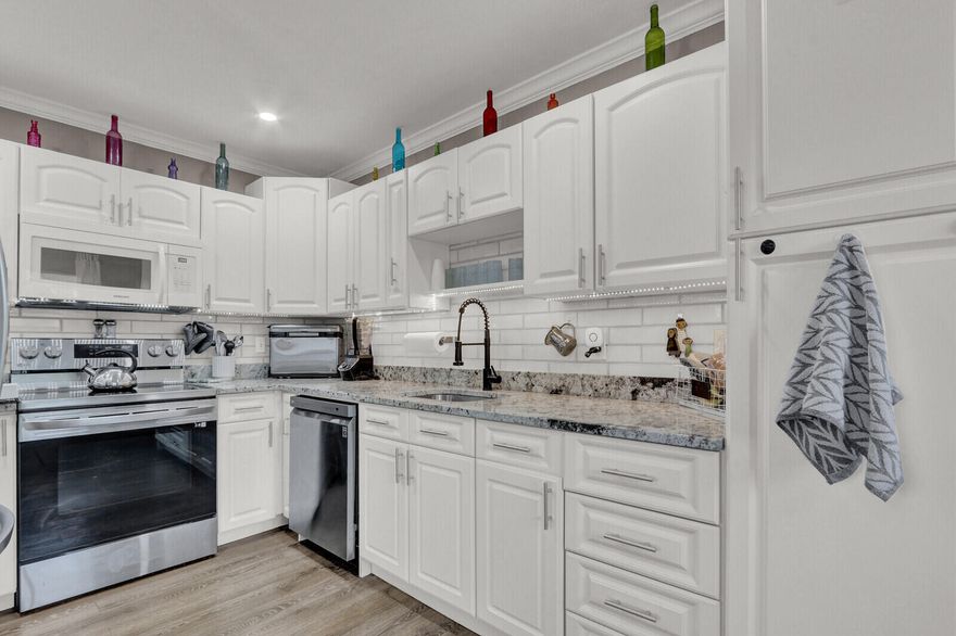 Welcome to effortless living in the heart of Kings Point, one of the area's most desirable 55+ communities. This beautifully refreshed 1BR/1.5BA residence offers a bright, airy interior where sunlight pours through every room, highlighting the expansive open layout designed for comfort and easy entertaining. The kitchen has been thoughtfully modernized with crisp white cabinetry, neutral granite countertops, generous storage space, and stainless steel appliances that are just three years new. A sleek tile backsplash adds a contemporary touch, while durable waterproof laminate flooring flows seamlessly throughout the home for both style and practicality. Offered move-in ready, the unit includes the convenience of an in-home washer/dryer, tastefully updated bathrooms, and brand-new vanity tops. The A/C system is only two years old, providing energy-efficient peace of mind. Furnishings are negotiable, making this an easy transition for seasonal or full-time living.
The freshly painted building is equipped with a lift for effortless access, and residents enjoy an array of resort-inspired amenities including heated pools, a vibrant clubhouse, theater, and local bus transportation all fostering an active and social lifestyle.
An ideal blend of comfort, convenience, and community awaits. Arrange your private tour today and experience Kings Point living at its best!