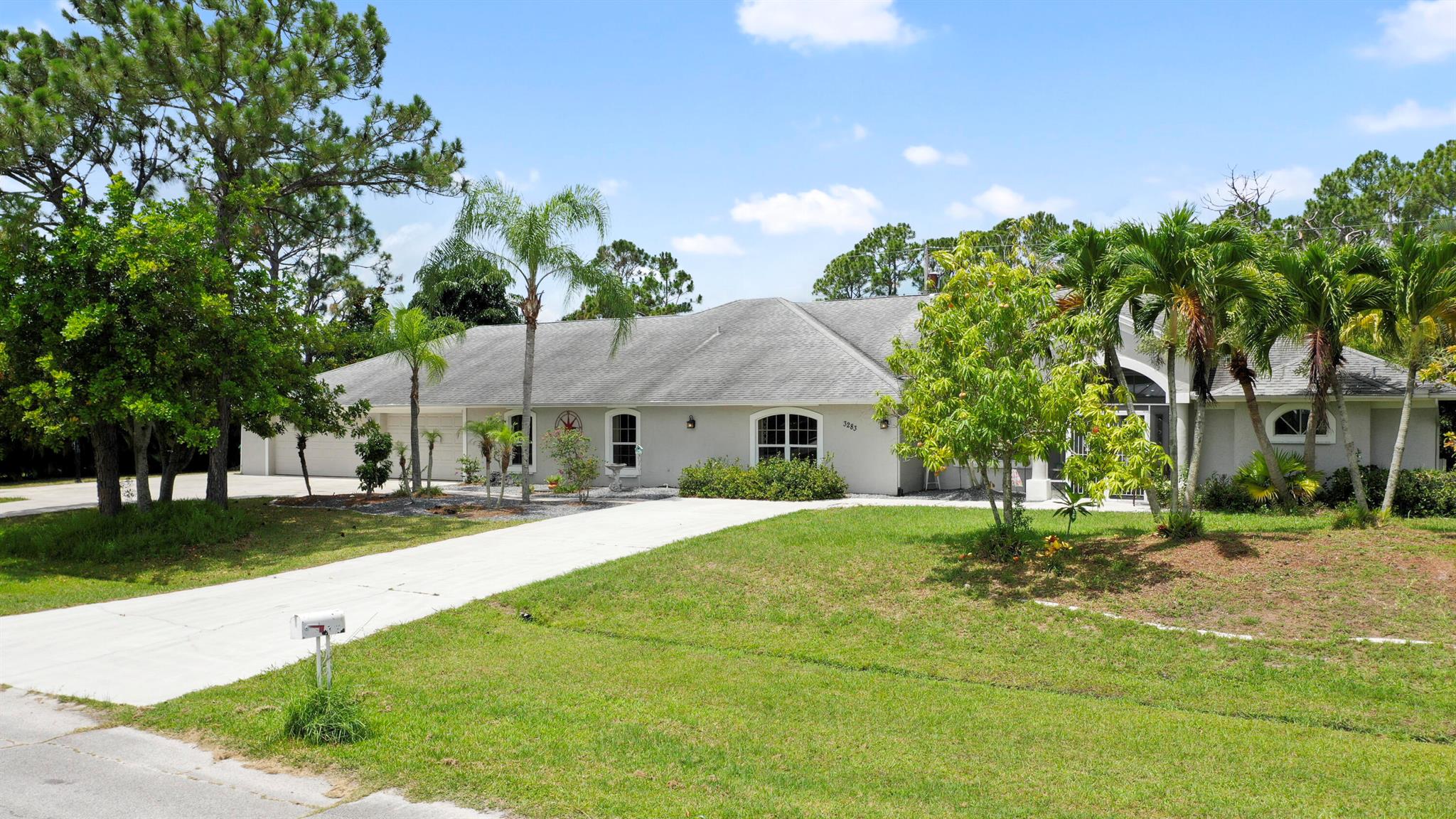 Welcome to your Oasis in Paradise! On almost one full acre sits this expansive 3700 sqft 4CG pool home ! This includes the master bedroom and updated bathroom, 1 ensuite, 3 LARGE bedrooms, and an indoor gym(6th bedroom). This home also features a formal dining, living, family, and sitting rooms. Indoor laundry with ample storage closets throughout. SS appliances, breakfast bar and pantry are great features of the kitchen. Screen enclosure covers the pool and deck with an additional patio behind the garage. Let's not forget the FULL SIZE tennis court, fully fenced and lighted. Friends and family can enjoy watching from the large viewing deck. The backyard also has a brick paver fire pit, multiple garden areas, a play-house and rose garden. Also has owned solar panels!Come see your new home