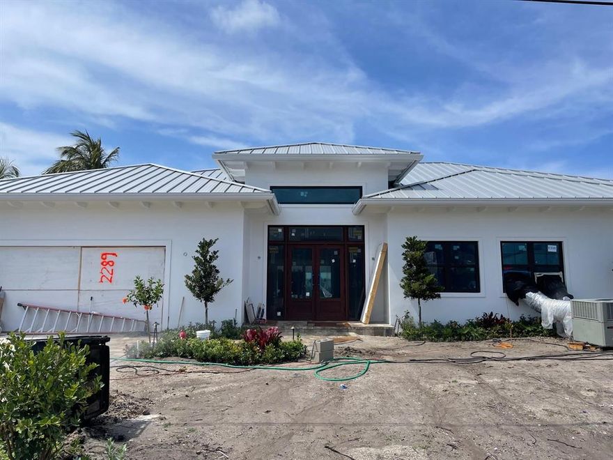 WEEKS AWAY FROM COMPLETION! Full Speed Ahead to Completion for this New Construction Dream Home! Pool/Spa Complete, Stunning Limestone Pool Decking, Turf Grass, Complete Landscaping Package, Flooring and Kitchen Cabinets Installed! Don't Wait to See this Beauty! 

No Fixed Bridges, in the Heart of Palm Beach Gardens. Bring Your Boat! This Property is a Stones Throw From the Intracoastal Waterway! Located in Unincorporated Palm Beach County, lower taxes, NO HOA, No Restrictions! 

Over 100' of water frontage on a deep water canal, just four lots from the intracoastal waterway! Incredible improvements have been made to the site in order to get it ready for a fantastic new construction masterpiece NEW SEAWALL COMPLETE! Bring your boat- easy in and out access to the intracoastal. Builder eliminating existing septic system with bringing in new county sewer system. Abundant living space including great room, family room, formal dining room and extended covered outdoor living space perfect for entertaining! Complete with a heated pool/spa to cool off after a day on your boat. The home is being built with the best quality materials and workmanship. High impact hurricane windows and doors throughout the home allow for abundant natural daylight and picturesque views of the beautiful pool/spa, the water and your boat. The house is perfect for entertaining with a wonderful flow from the indoors to the outdoors.

The master suite includes oversized his & her closets, a spacious bathroom with a dual shower, soaking tub, and separate toilet room all finished in the highest quality marble and quartz. Enjoy relaxing in your heated spa with private access to the pool deck through your master suite. This Key West Inspired Semi-Custom Pool Home is Located Along One of the Most Desirable Waterfront Communities in Palm Beach Gardens. A True Boaters Paradise- Don't Miss Your Chance to Live Where Others Vacation
Please contact Listing Team for Floorplans and renderings