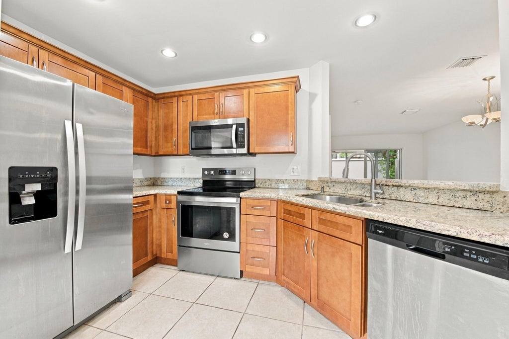 Photo of 4441 SW 11th Place, Deerfield Beach, FL 33442 (MLS # B26076315)