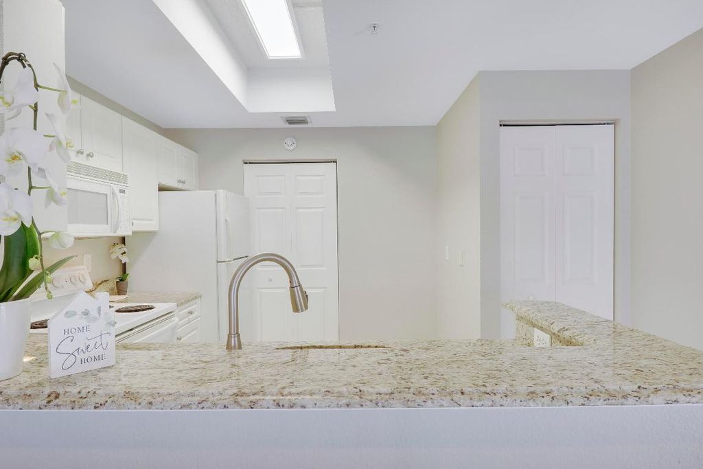 Photo of 2809 Amalei Drive #103, Palm Beach Gardens, FL 33410 (MLS # R10930402)