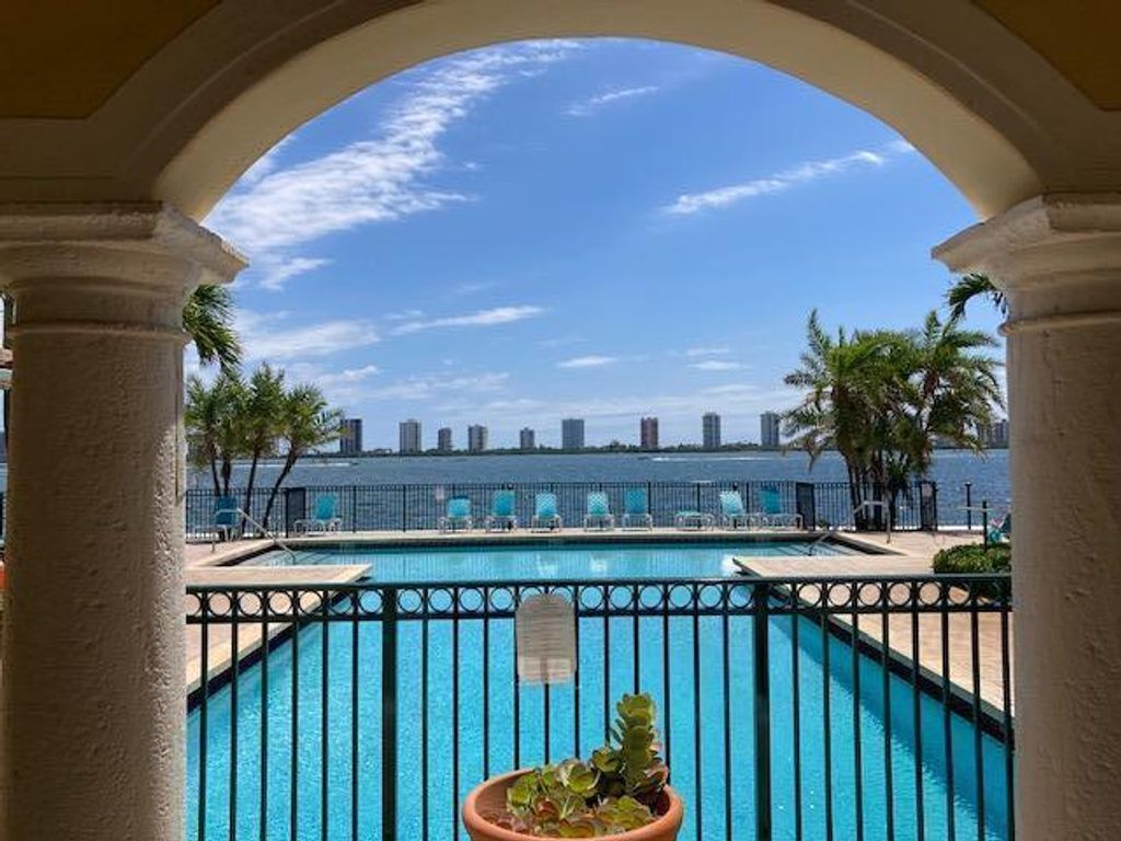 Photo of 1040 Lake Shore Drive #201, Lake Park, FL 33403 (MLS # R10715520)