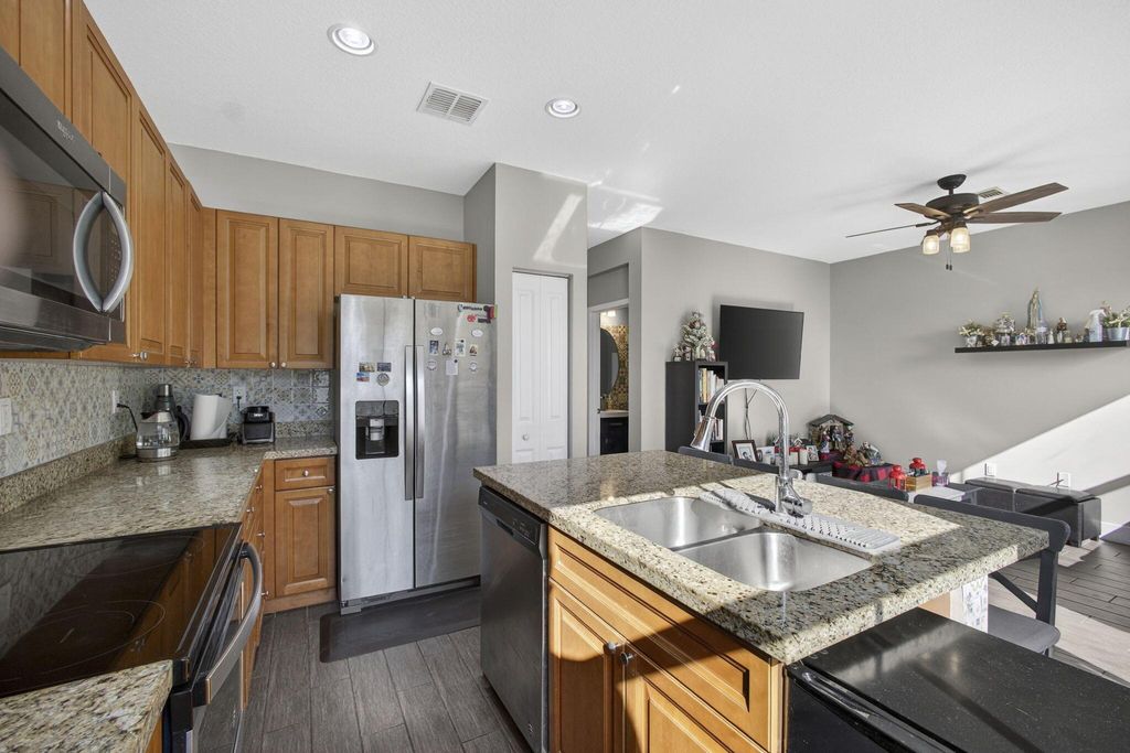 Photo of 6017 Pine Tree Way, Riviera Beach, FL 33410 (MLS # R11149043)