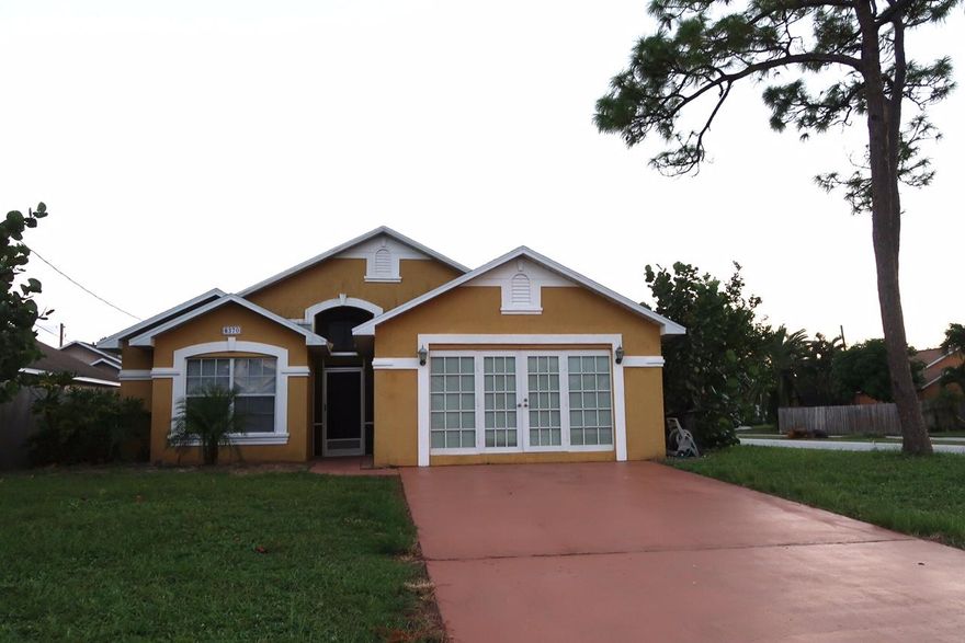 This spacious 3B/2B house offers: 1) An about 3 year old AC unit; 2) A large family/living room with open kitchen; 3) Split floor plan; 4) Tile or laminate flooring of entire house (No Carpet!); 5) Spacious screened and tile-paved back patio; 6) Fully fenced backyard; 7) A huge bonus room under AC (converted from the 2-car garage) with tile flooring and ceiling fan, and etc.