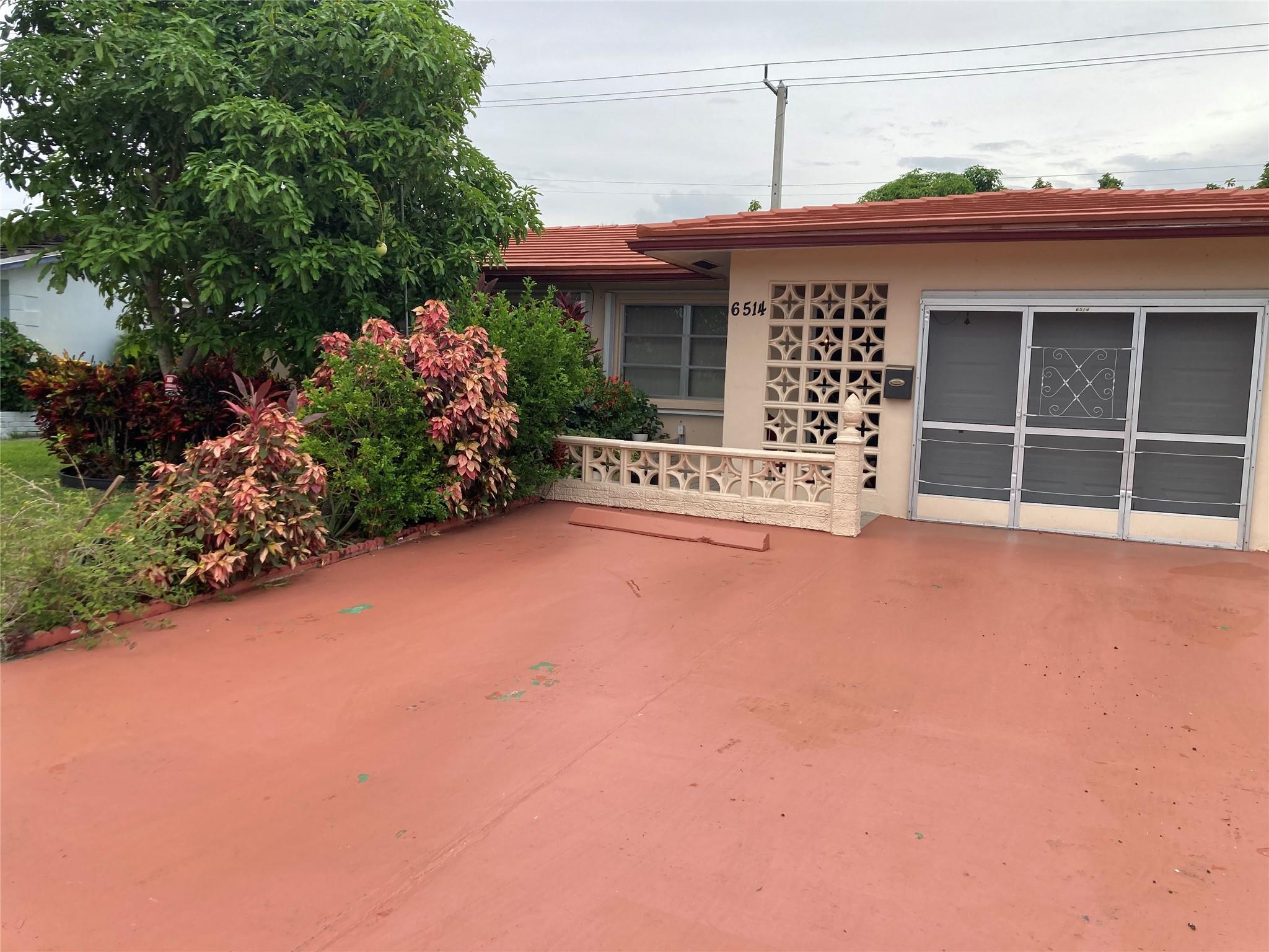 Beautiful and Spacious 2 Bedrooms 2 Baths with Enclosed huge Florida Room with AC that be converted to 1 or 2 Bedrooms if you have a big family, one car attached Garage with automatic garage opener in Pristine and peaceful Mainlands 8 section a 55 Plus Community. The back yard features all kinds of tropical Fruit trees like Avocado trees, Mango trees, Banana trees and so forth. Come . Serene Location come live your best life in this great community with planned recreational activities, a Sparkling Community pool & Playground. Children 18 years of age or Older are welcome.