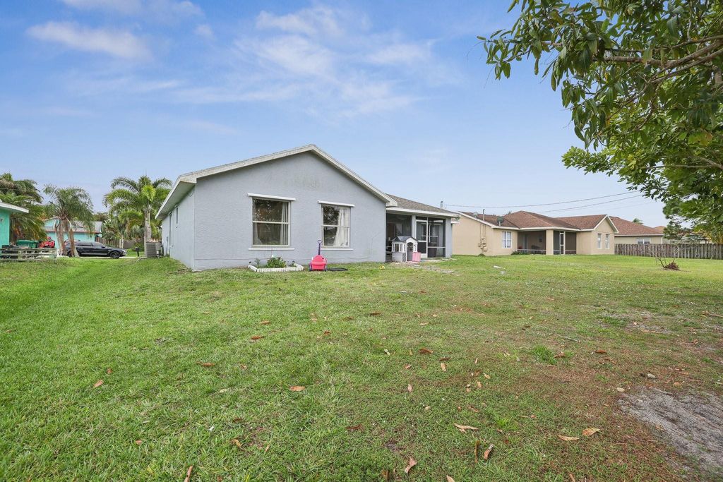 Photo of 465 SW Eyerly Avenue, Port Saint Lucie, FL 34983 (MLS # F10430438)