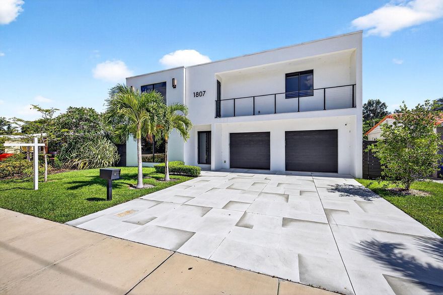 Live in style in this 4-bed, 4.5-bath contemporary gem with soaring ceilings, floor-to-ceiling windows, and a bright, open layout. The chef's kitchen boasts waterfall countertops, JennAir appliances, walk-in and butler's pantries. First-floor bed & bath, plus brand-new custom closets--including a primary suite closet with island.Step outside to your private oasis: heated saltwater pool with sun shelf, summer kitchen, marble pool deck, and new paver driveway.Built in 2022. No HOA. Under 3 miles to the beach, and walking distance to Trader Joe's, Whole Foods, cafes, yoga studios & more!