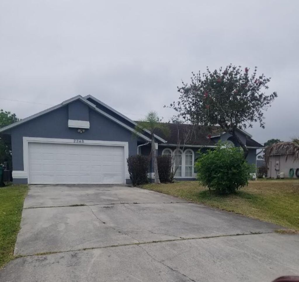 Photo of 2248 SW Halissee Street, Port Saint Lucie, FL 34953 (MLS # B26033208)