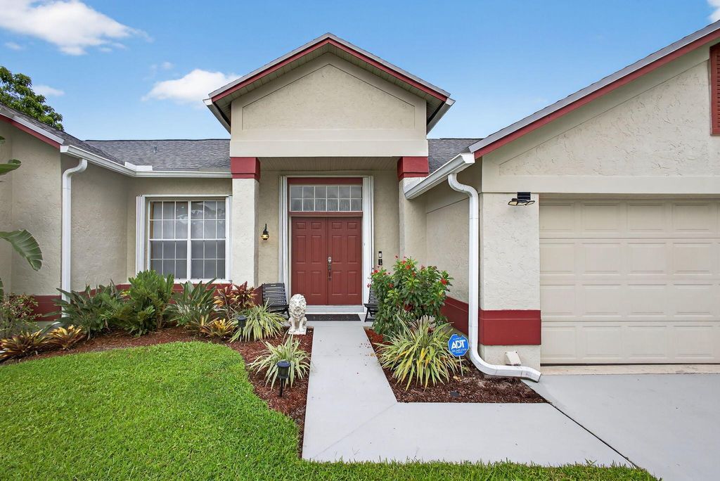 Photo of 155 Royal Pine Circle S, Royal Palm Beach, FL 33411 (MLS # R11117367)