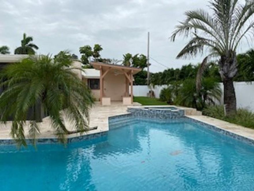 Absolutely fantastic home. Huge open plan. 40 FT family room, fireplace, eat-in kitchen, 2 1/2 car garage, double sized pool with spa and waterfall, gazebo, fenced yard. Look at the pictures! This is the best you will find!! Quiet neighborhood, sidewalks, and only 5 minutes to the beach!