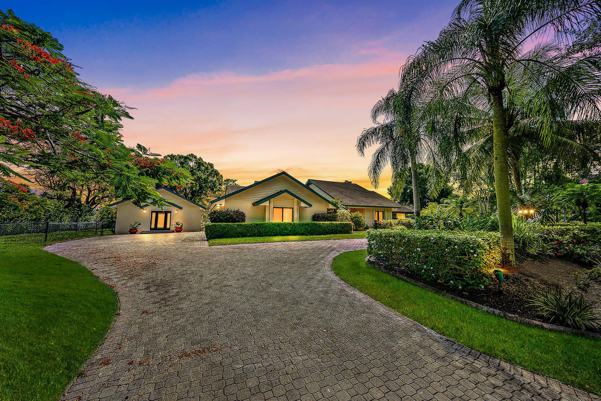 A truly unique home with a detached 1 bed 1 bath guest house overlooking the 11th green in Turtle Creek Club! The main home with 4 beds and 5 full baths boasts a high end Tuscan feel with an expansive open living concept. This stunning CBS pool home has travertine french cut tile, vaulted ceilings and pocket sliding doors welcomes natural morning light that lasts throughout the day. The home also includes new full impact windows and doors, new AC units, plantation shutters, updated bedrooms and more! The primary suite overlooking the pool and golf course includes two walk-in closets with built ins and two fully renovated bathrooms. Each additional bedroom has its own full bathroom and plenty of closet space. Make this spectacular property your home in this highly desirable gated community