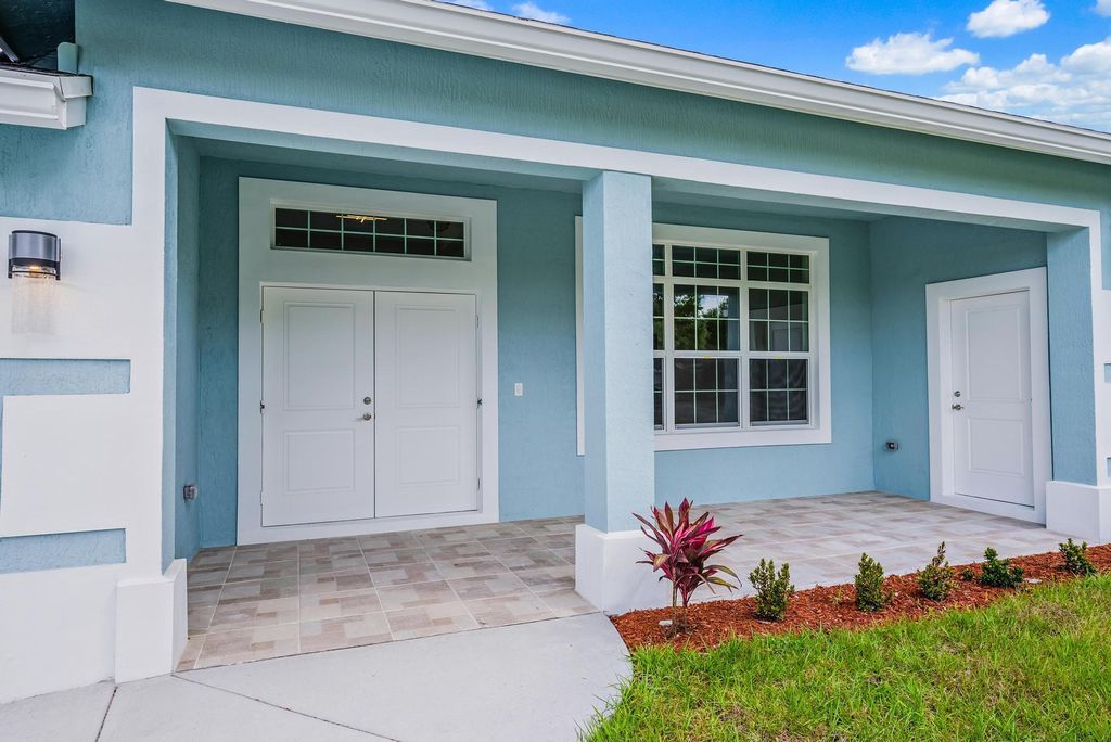 Photo of 579 NW Azine Avenue, Port Saint Lucie, FL 34983 (MLS # R10959512)