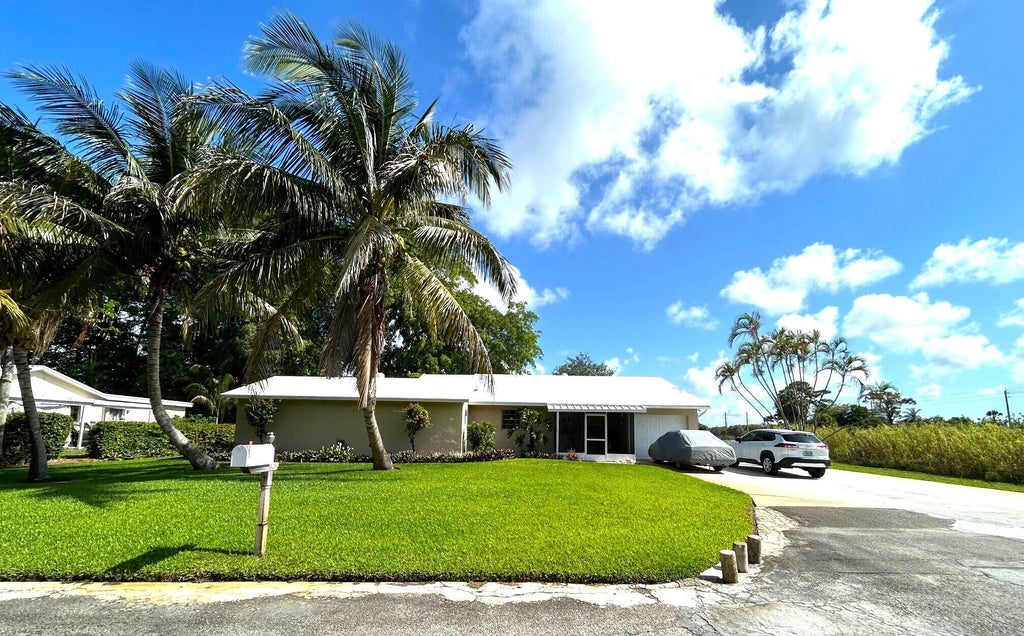 Photo of 6433 33rd Court, Greenacres, FL 33463 (MLS # R11088461)