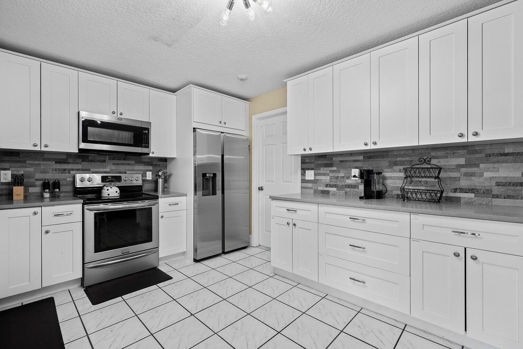 Photo of 13724 Lilac Place, Wellington, FL 33414 (MLS # B26014115)