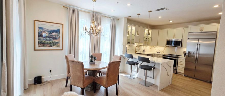 This beautiful 3 bedroom / 2 bath unit in Courtyards at Nautica just underwent complete remodeling, with new high-end kitchen and bathrooms, porcelain wood flooring, LED lighting throughout, window treatments and much more. Kitchen appliances include built in GE Monogram refrigerator with water dispenser, GE Monogram dishwasher, GE Profile Range and Microwave, built in wine fridge. Beautiful shower clad with exquisite porcelain tiles, double vanity in the main bathroom, new modern tub in the second bathroom, lighted mirrors in both baths. All windows and doors are hurricane impact, which also provide safety, noise reduction, energy savings.  This is a well maintained, secure gated community, with mature landscaping, beautiful pool with jacuzzi, gym and community room. On-site management and maintenance personnel. Pet friendly community. Courtyards at Nautica is located in close proximity to I-75, beautiful parks, shopping and dining. Easy commute to Miami and Fort Lauderdale. Great schools.