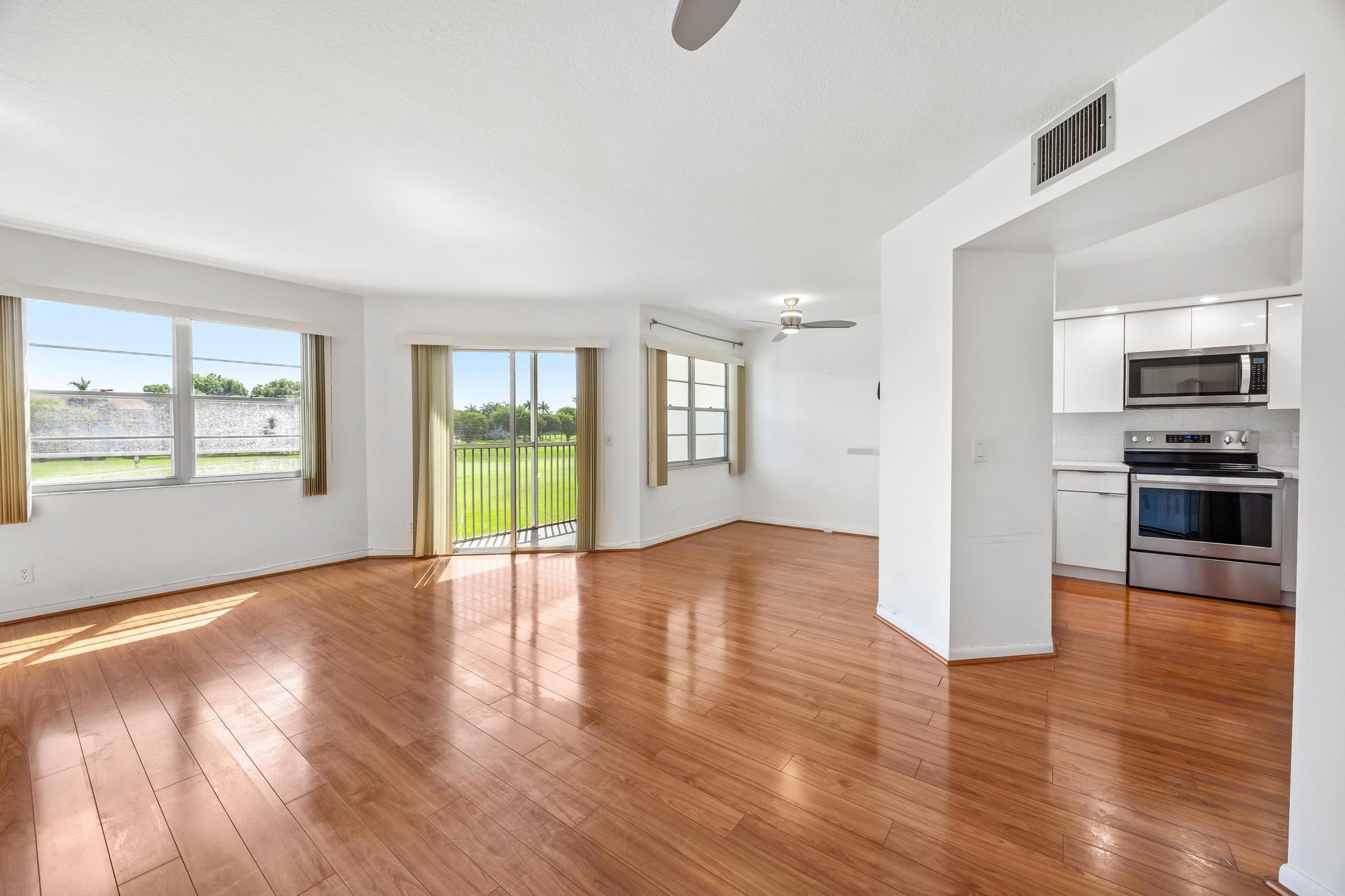 Beautiful and bright condo located in the heart of Pembroke Pines! Walk into this spacious 1 bed 1 bath unit with an amazing view of the golf course and greenery. New kitchen with plenty of cabinet space, stainless steel appliances, quartz countertops, wood floors throughout. Renovated bathroom. Washer and dryer conveniently located inside the unit, assigned parking & plenty of guest parking. Century Village is one of Pembroke Pines most desirable active adult communities, providing incredible resort-style amenities including a state-of-the-art clubhouse, 1000-seat theater with free weekly movies, billiard room, two fitness centers, security gate, 27 pools, 18 tennis courts, and a courtesy bus. Association dues cover water, trash, sewer, cable, internet, clubs. Welcome home!
