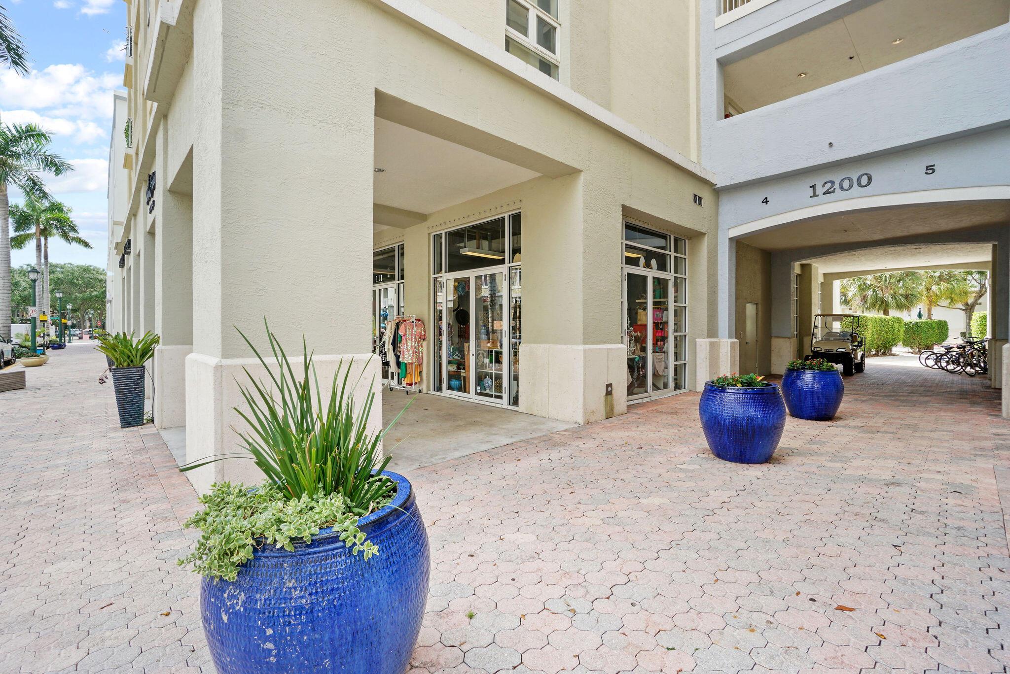 South facing CORNER residence with lots of light! Two split bedrooms with large covered balcony off of the primary. Perfect downtown Abacoa location. Enjoy walking to the many restaurants, bars, shoppes, fitness centers. Beautiful floors throughout, no carpet. Ready for move in October 1st, 2025.