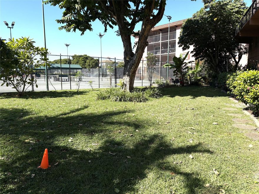 Located in the Tennis Club of Fort Lauderdale along the Middle River, you enter a Tropical Courtyard, & into the ground floor Apt itself. Beyond is a bright Living Room & half-bath, next to an open kitchen, with custom cabinets, recessed lighting, matching appliances, & dining area beyond. The spiral staircase leads up to two main split bedrooms, with updated bathroom between. Tile downstairs, Carpet upstairs. The open tiled patio has spectacular views of the tennis courts, along with the bldgs own grassy park area. An adjacent private pathway leads to all the amenities- 20 Clay Tennis Cts, (10 Lighted ), 3 Hard Cts , Heated Pool & Hot Tub, fully equipped Gym, full serviced Patio Bar & Grille. Gated 24/7 security. Pets ok. Close to beaches, Wilton Manors, Downtown Ft Lauderdale, Airport.