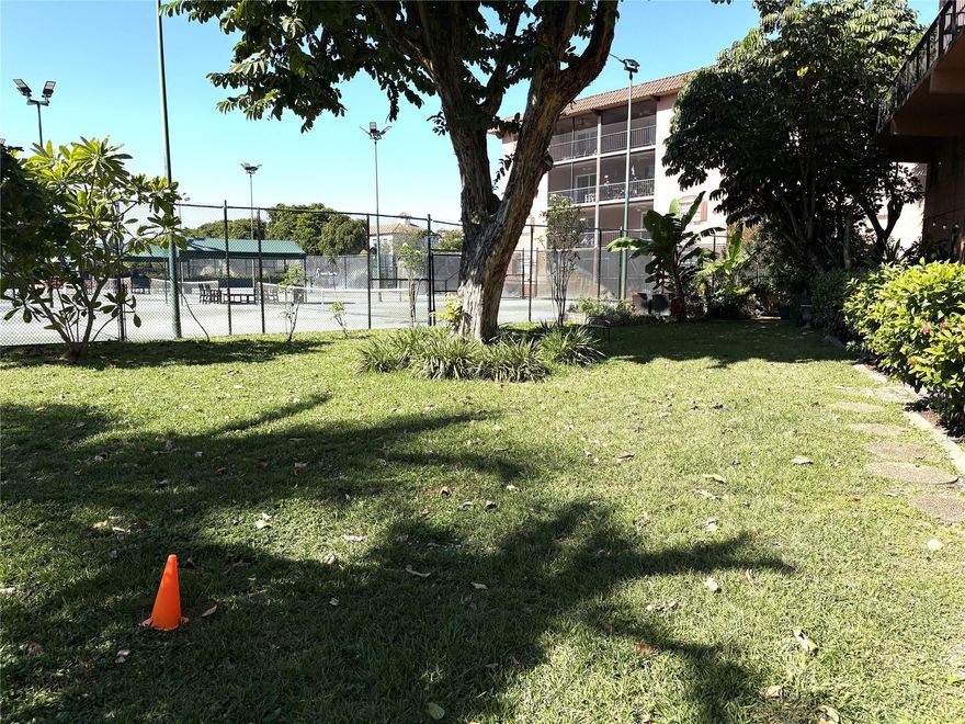 Located in the Tennis Club of Fort Lauderdale along the Middle River, you enter into a bright Living Room w/ half-bath, next to an open kitchen, with custom cabinets, recessed lighting, matching appliances, & dining area beyond. The spiral staircase leads up to two main split bedrooms, with updated bathroom between. Tile downstairs, Carpet upstairs. Crown molding in living room, dining area , master bedroom. The open tiled patio has spectacular views of the tennis courts, along with the bldgs own grassy park pet,area. An adjacent private pathway leads to all the amenities- 20 Clay Tennis Cts, (10 Lighted ), 3 Hard Cts , Heated Pool & Hot Tub, fully equipped Gym, full serviced Patio Bar & Grille. Gated 24/7 security. Pets ok. Close to beaches, Wilton Manors, Downtown Ft Lauderdale, Airport.