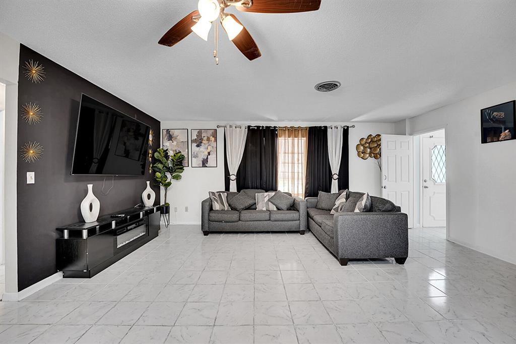 LEADING YOU HOME to this spacious Port Saint Lucie gem priced for a quick sale! 2-bedrooms, 2-bathrooms with BONUS Room with a One car garage and NO HOA!!!! Bonus room offers the perfect blend of comfort and potential. This house provides a fantastic opportunity to customize and make it your own. The large backyard with Fruit trees—big enough for a pool—makes it ideal for entertaining or relaxing. Enjoy a bright, open living space with easy access to highways, shopping, dining, and entertainment. Best of all since there's no HOA you have the freedom to create your dream home!" Seller is Motivated!!!!