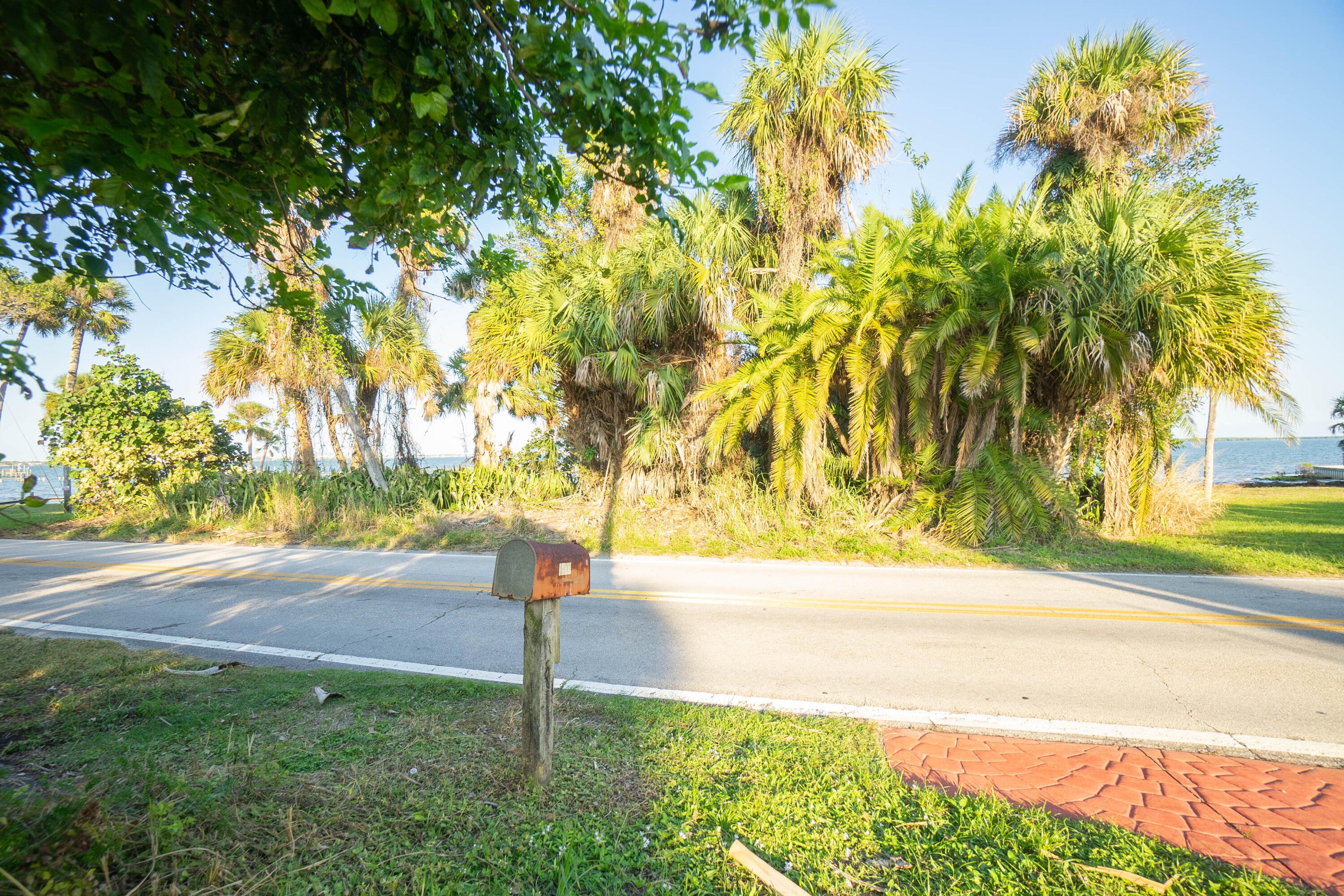 Just shy of an Acre! This Unique Waterfront Property is located on Florida's Scenic Indian River Drive and has 85 ft+/- of private sandy beach, pilings standing ready for a dock, which once restored, will make the perfect place to park your boat as it is located on the Intracoastal Waterway, just 3 nautical miles for the Fort Pierce Inlet. There is a home home, built in 1920's on the property that although magnificent in its time, is in disrepair and will need to be torn down, making way for you to build a beautiful waterfront home on and ''old Florida''property located within a mile from downtown Fort Pierce.