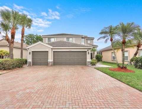 Photo of 5690 Saddle Trail Lane, Lake Worth, FL 33449 (MLS # B26012572)