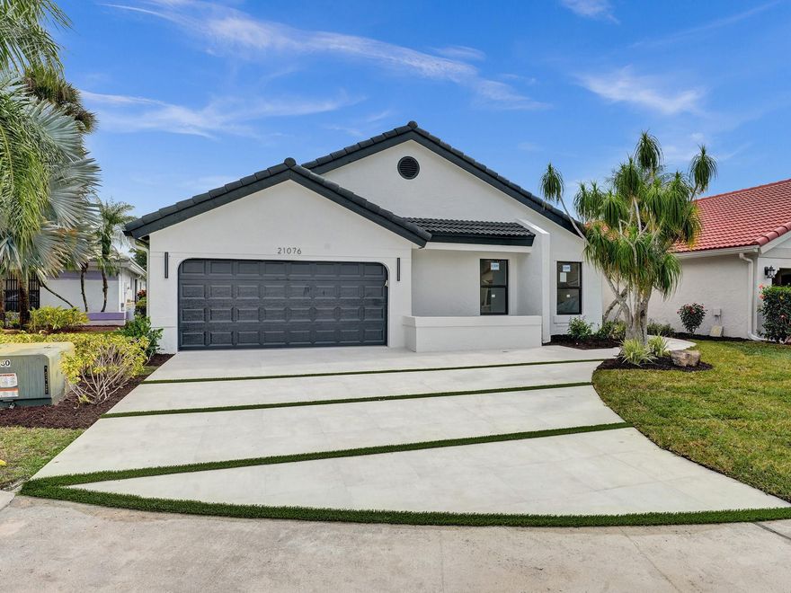 **WOW! Everything You've Dreamed Of!**Step into luxury with this completely renovated, breathtaking three-bedroom, two-bathroom home in Boca Raton's coveted Boca Woods community. Perfectly situated in the heart of Boca Raton, this move-in ready haven offers the ultimate lifestyle.Features & Amenities: Newly renovated with exquisite attention to detail.Spacious three bedrooms and two bathrooms. Stunning matte finish porcelain tiles.Brand new LG appliances and custom white shaker cabinetsQuartz countertops, Master bedroom with workstation area and custom closetsSpa-like bathrooms, LG washer and dryerHurricane windows and doors. New garage door. Don't miss out on this incredible opportunity to live the lifestyle you deserve in the heart of Boca Raton.