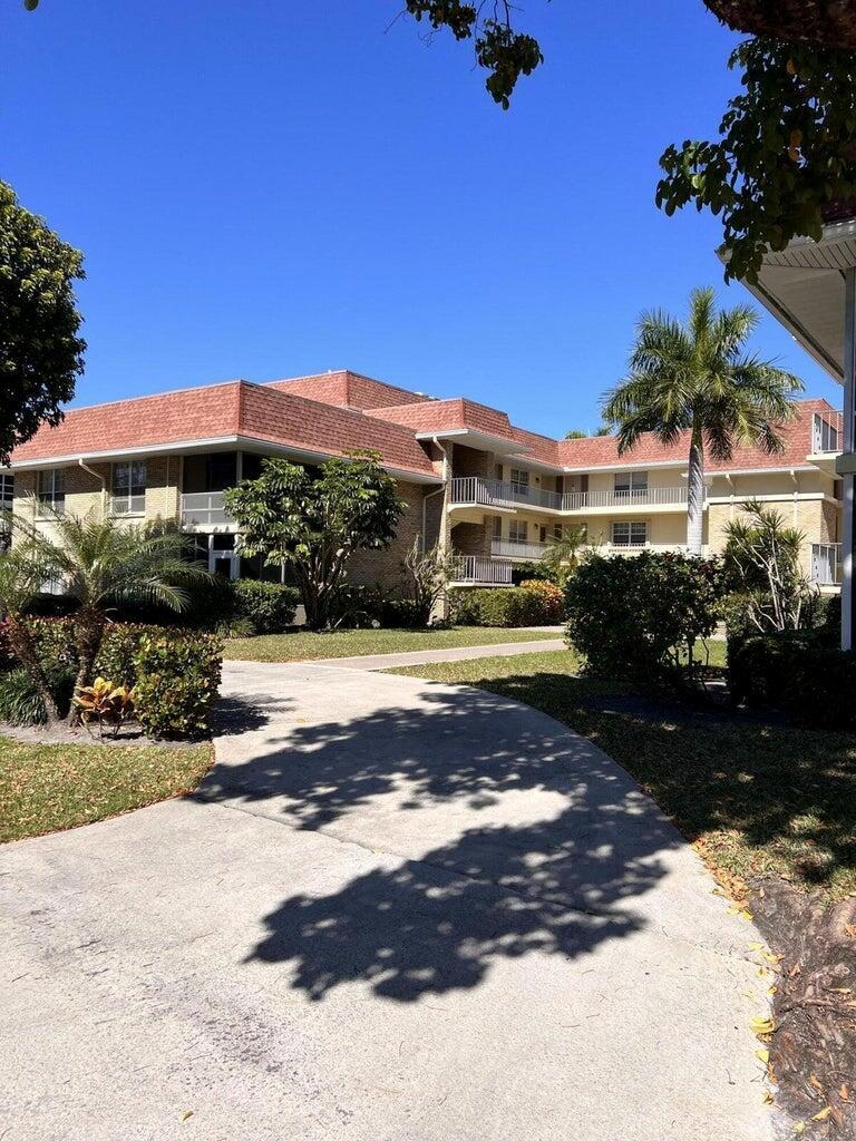 Stunning Move-In Ready 2BR/2BA Condo! Furnished & Beautifully renovated second-floor unit with smart split floor plan. Features ceramic tile and laminate wood flooring, crown molding, and ceiling fans throughout. Updated kitchen with modern appliances opens to spacious living/dining area. Master suite includes renovated en-suite bath and walk-in closet. Guest bedroom offers privacy with full bathroom and ample storage. Enjoy your enclosed patio and dedicated carport, Steps to community laundry. Walk to dining and shopping. Ready for immediate occupancy!