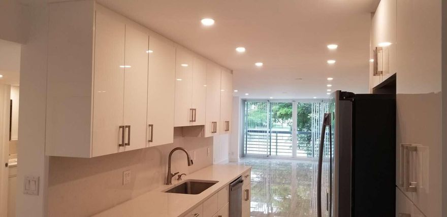 Beautiful renovated condo in Wynmoor. Brand new kitchen and bathrooms. Wood Look porcelain floors throughout, Hurricane glass enclosed patio for additional living space, LED recessed lighting, Walk in Closets in both bedrooms. Zero entry walk in showers in both bathrooms, Washer/Dryer hookup in unit!!!