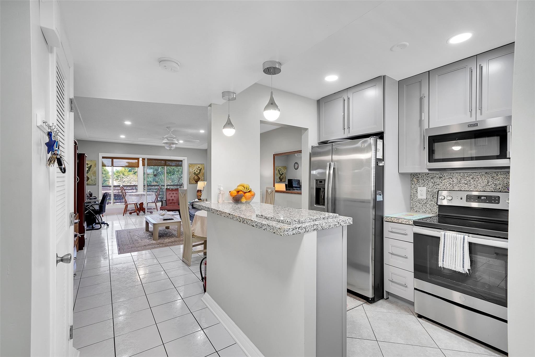 55+ COMMUNITY IN PHASE 3. 3rd FLOOR, TOP FLOOR CORNER UNIT IN WELL KEPT BUILDING 88, 2 BEDROOMS 2 BATHS. GREAT WATER VIEWS FROM ENCLOSED PATIO. IMPACT WINDOWS. TILE THROUGH OUT, GRANITE COUNTER TOPS, STAINLESS STEEL, OPEN KITCHEN WITH DESIGNER LIGHTING. GREAT WATERVIEW FROM FLA ROOM, THAT CAN BE USED AS A DEN OR ADDITIONAL BEDROOM. LOCATED NEAR A SATELLITE CLUBHOUSE, YEAR ROUND HEATED POOL, SAUNA, BILLARDS, TENNIS AND PICKLEBALL COURT, WATER VIEWS FROM PATIO. JUST LISTED WON'T LAST! THE ASSOCIATION REQUIRES PROOF OF INCOME AND CREDIT SCORE.