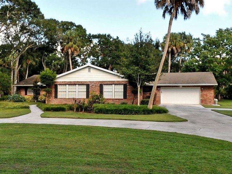 Executive home on one acre. Beautiful home surrounded by old Florida Oaks on a quiet dead end street close to the State College.  Framed with American Steel, and finished with red brick, this home is sure to please. Large screened  lanai, formal living and dining rooms, informal dining room, extra spacious family room with built in. Two master suites, workshop area in garage, extra large kitchen with plenty of storage and counter top space, double wall oven, double wall pantry, breakfast area, as well as built in desk area. Circular driveway for additional parking.  Well appointed Florida landscaping.