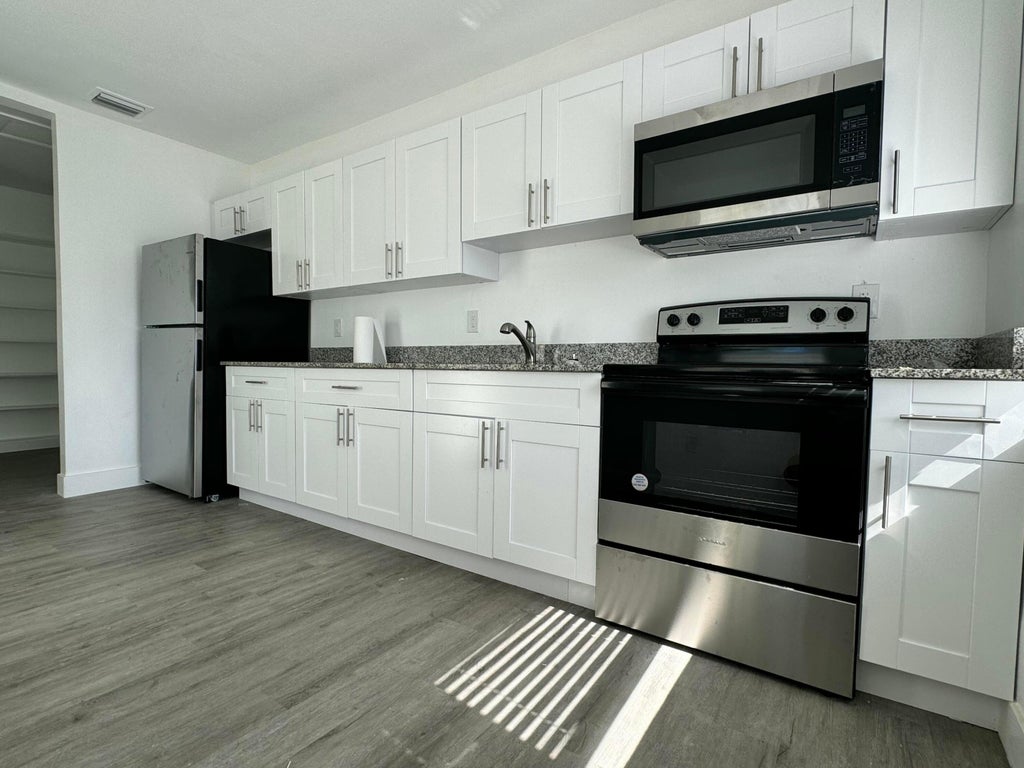 Photo of 1833 Madison Street, Hollywood, FL 33020 (MLS # B26069389)