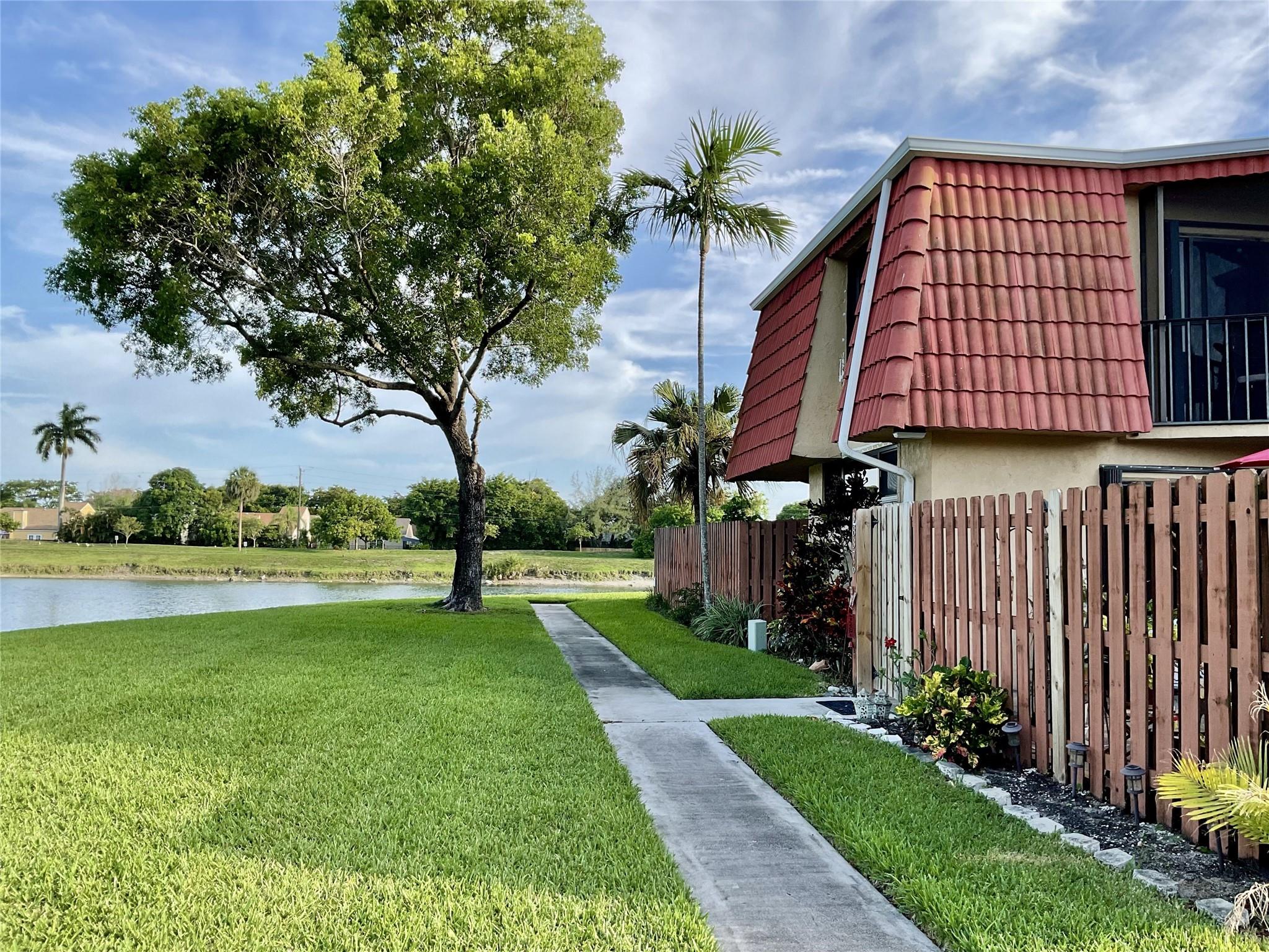 Now is your chance to own a Beautiful TH with lots of upgrades and sweeping views to the lake. Walk around the lake with your dog and enjoy nature to it's best. This flow-through Townhouse unit features 2 master suites, a family room, and a beautiful kitchen with great seating area. Impact windows in the front of the house and accordion inside the court yard, where you can grow you plants and have a nice store area for your tools. Plenty of closets and cabinets to store all your needs. All appliances were upgraded recently.