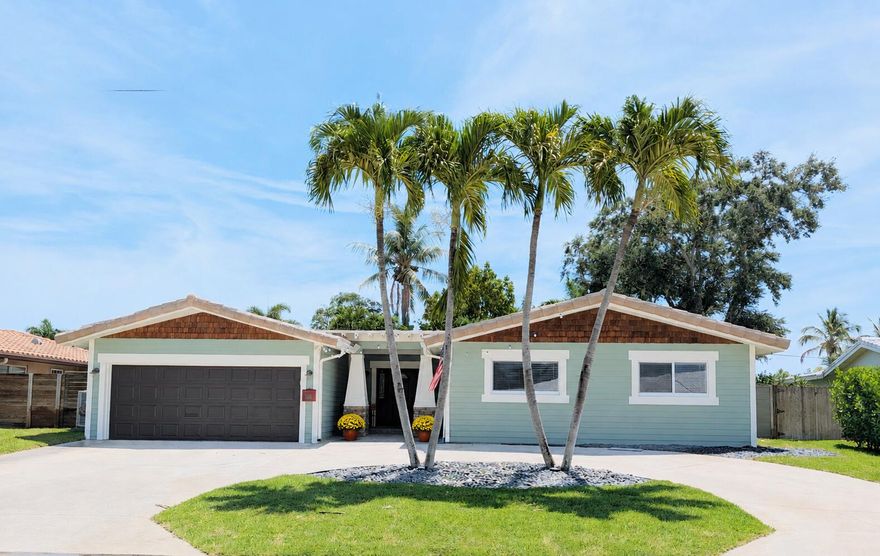Delightful Lake Floresta Park home in East Boca Raton - No HOA. Located within the Addison Mizner School District, this Craftsman style frontage is unique in Boca Raton.  Featuring 4bd/2ba/2cg PLUS a multi-purpose room, perfect for game nights, an office or in-home gym. The low maintenance backyard is fully fenced and offers decorative turf, a covered & open patio, gazebo & a finished shed with a/c. Inside, you will appreciate the updated baths & kitchen, vaulted ceilings and the flood of natural light in the open living room. The home is freshly painted inside & out. This is a great place to call home and to make new memories! Enjoy fun occasional neighborhood gatherings! 232 NW 10th Ct is so close to Boca Regional Hospital, Downtown, Beaches, I-95 and nice casual eateries like Tomasso's! If you prefer to have an upscale night on the town there is plenty to experience as well, all within a 5 minute car ride. This is the place to live, work and play and there is something for everyone!   Located next to Historic Old Floresta, Lake Floresta Park is a hidden gem neighborhood that is so close to everything but feels just off the beaten path. You will love it here. Come on home!   Other great features of this home include a large primary bedroom with a beautiful ensuite bath, walk-in closet and access to the backyard. The additional bedrooms are of generous size too. The bonus room gives you the elbow space that we all crave. The laundry room has great storage shelves for all of your "stuff" and access to outside. The airy kitchen has a great amount of counterspace, stainless steel appliances, nice cabinet storage, 2 serving bars and door access to the backyard grilling area. The large sliders off the living room gives access to the nice covered patio and fenced back yard with a firepit. This is also a great space for maybe a pool, hot tub or a swing set. The front of the house features a circular drive with enough parking for 4 cars plus the 2 car garage spaces. A new hot water heater and smart garage door opener have recently been added. The landscaping is fresh and has charming accent lighting. The side yards are well maintained and finish off the grounds nicely.