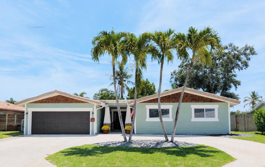 Delightful Lake Floresta Park home in East Boca Raton - No HOA. Located within the Addison Mizner School District, this Craftsman style frontage is unique in Boca Raton.  Featuring 4bd/2ba/2cg PLUS a multi-purpose room, perfect for game nights, an office or in-home gym. The low maintenance backyard is fully fenced and offers decorative turf, a covered & open patio, gazebo & a finished shed with a/c. Inside, you will appreciate the updated baths & kitchen, vaulted ceilings and the flood of natural light in the open living room. The home is freshly painted inside & out. This is a great place to call home and to make new memories! Enjoy fun occasional neighborhood gatherings! 232 NW 10th Ct is so close to Boca Regional Hospital, Downtown, Beaches, I-95 and nice casual eateries like Tomasso's! If you prefer to have an upscale night on the town there is plenty to experience as well, all within a 5 minute car ride. This is the place to live, work and play and there is something for everyone!   Located next to Historic Old Floresta, Lake Floresta Park is a hidden gem neighborhood that is so close to everything but feels just off the beaten path. You will love it here. Come on home!   Other great features of this home include a large primary bedroom with a beautiful ensuite bath, walk-in closet and access to the backyard. The additional bedrooms are of generous size too. The bonus room gives you the elbow space that we all crave. The laundry room has great storage shelves for all of your "stuff" and access to outside. The airy kitchen has a great amount of counterspace, stainless steel appliances, nice cabinet storage, 2 serving bars and door access to the backyard grilling area. The large sliders off the living room gives access to the nice covered patio and fenced back yard with a firepit. This is also a great space for maybe a pool, hot tub or a swing set. The front of the house features a circular drive with enough parking for 4 cars plus the 2 car garage spaces. A new hot water heater and smart garage door opener have recently been added. The landscaping is fresh and has charming accent lighting. The side yards are well maintained and finish off the grounds nicely.