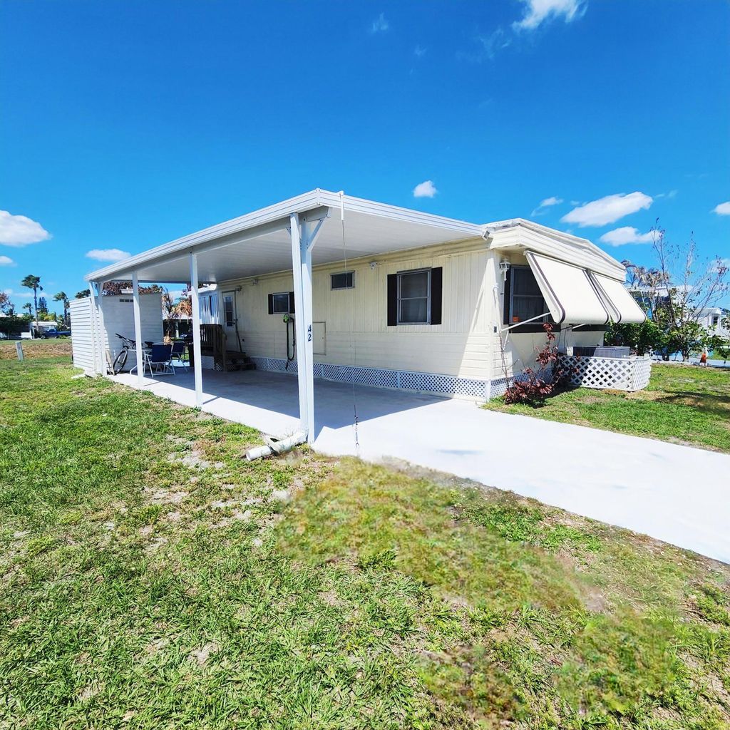 Photo of 42 SE Spanish Way, Port Saint Lucie, FL 34952 (MLS # B26019159)