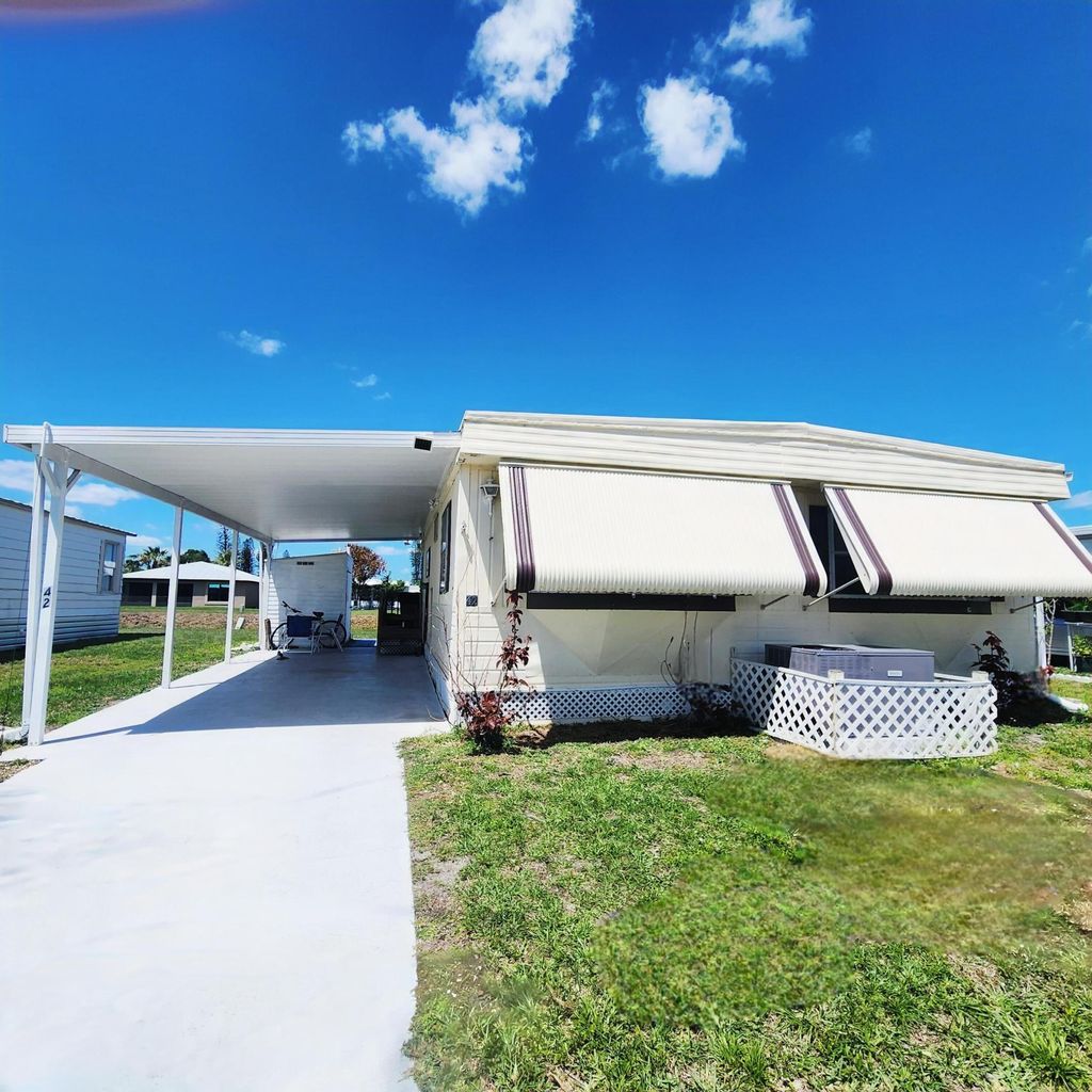 Photo of 42 SE Spanish Way, Port Saint Lucie, FL 34952 (MLS # B26019159)