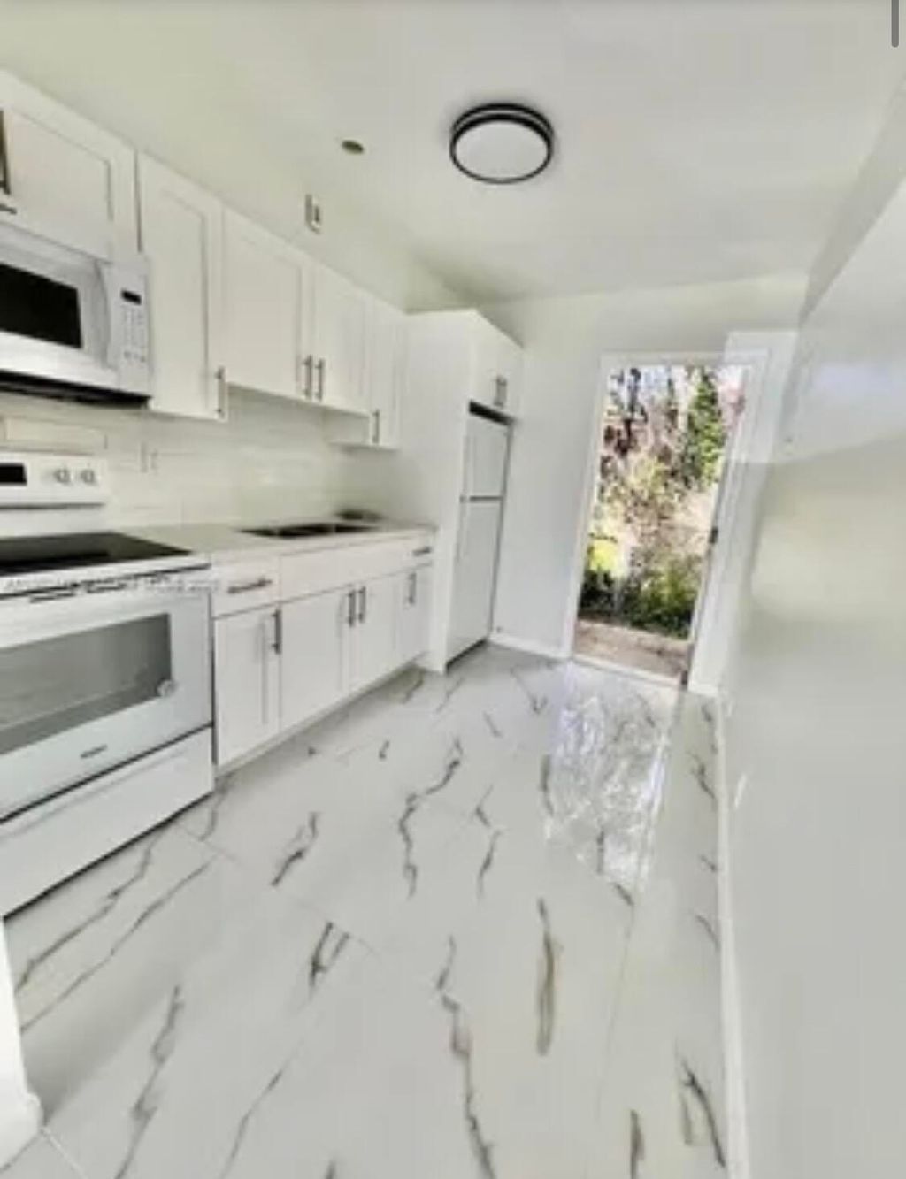 Photo of 4951 SW 26th Avenue #1-2, Dania Beach, FL 33312 (MLS # B26042624)