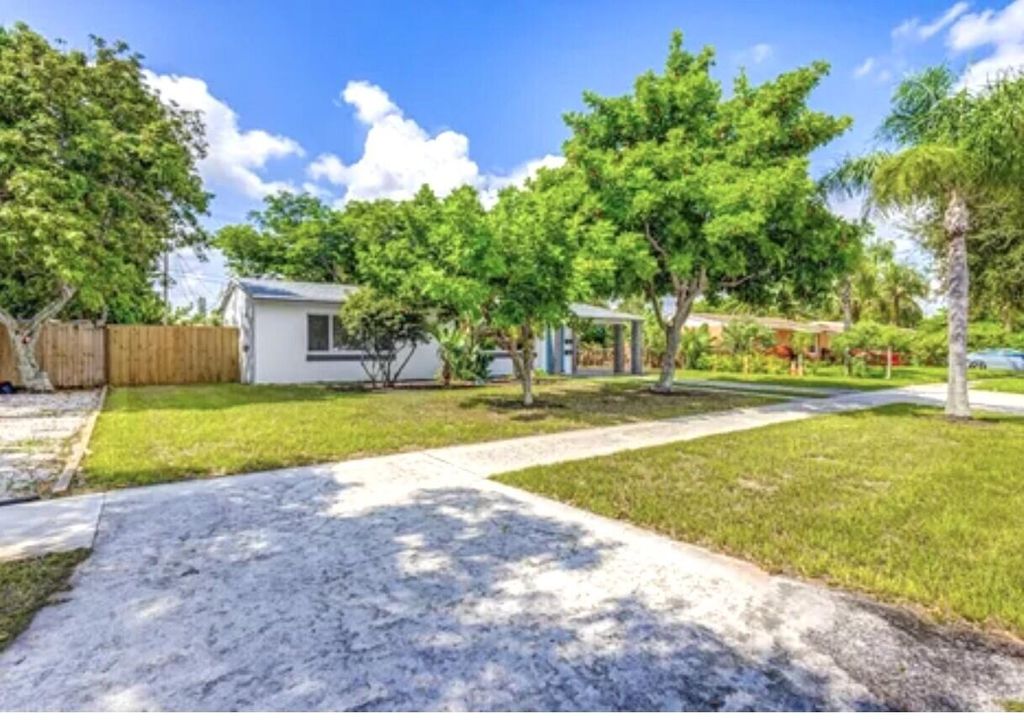 Photo of 512 Bayberry Drive, Lake Park, FL 33403 (MLS # R10990806)