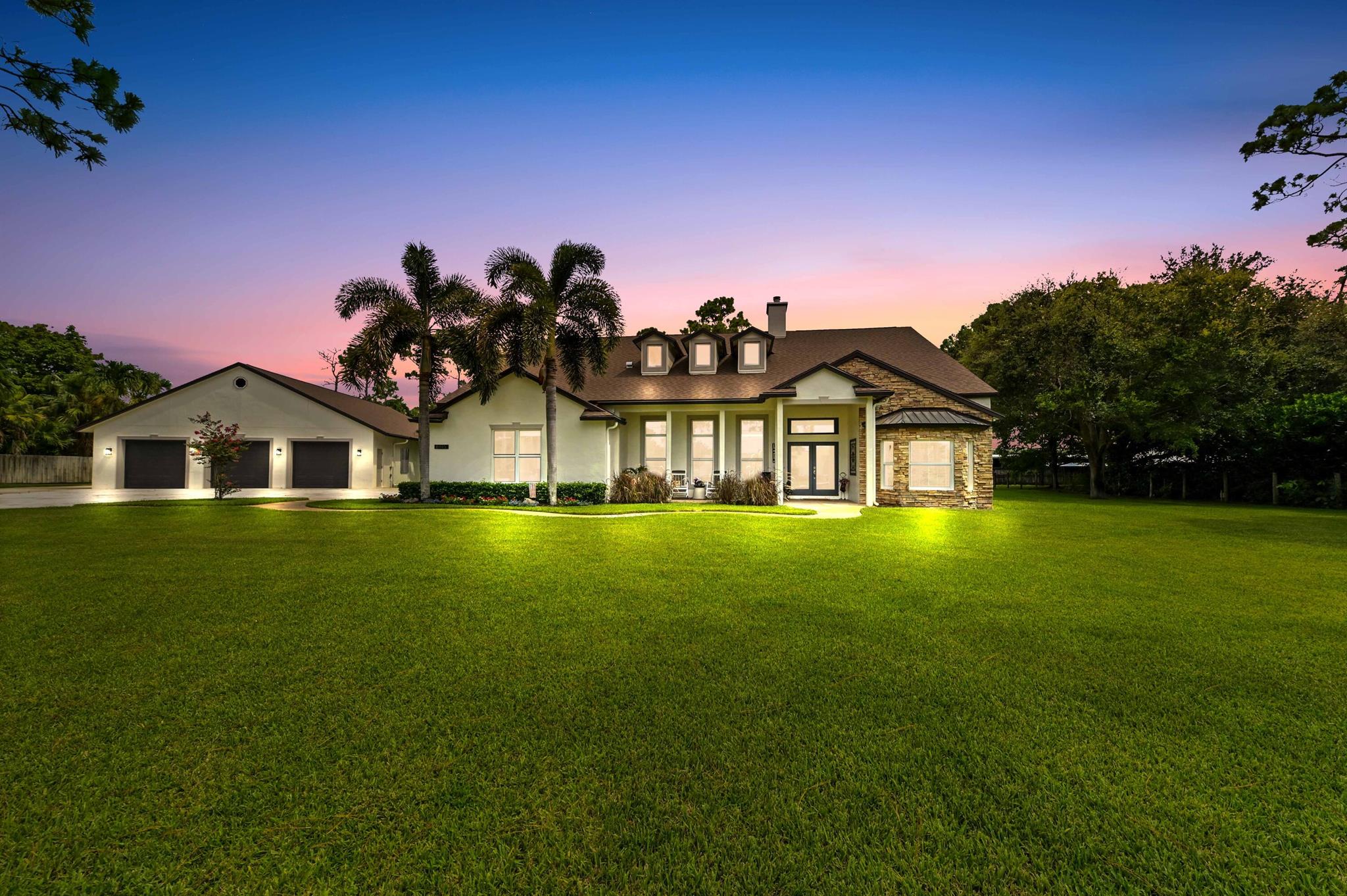 Prepare to be utterly captivated by this one-of-a-kind, custom-built masterpiece, meticulously maintained inside and out, and perfectly situated on a private 1-acre lot in the desirable equestrian non-HOA community, the Ranchettes! This exceptional pool home with a new roof features a split floor plan with 4-bedrooms, 3.5-baths and was built with quality and exudes comfort. The guest wing can also be easily used as mother in law quarters! Step inside to discover a grand main living area boasting breathtaking 17-foot ceilings, real hickory wood floors and a floor-to-ceiling stone fireplace, creating an awe-inspiring focal point. Each of the four bedrooms offers luxurious 9-foot tray ceilings, adding an extra touch of sophistication.