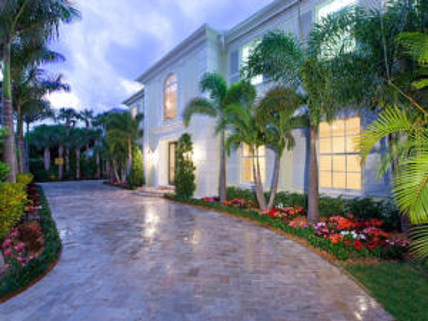 Experience the epitome of luxurious in-town living.  Located on the Ocean block of Peruvian Avenue, this home, originally built in 1997, was totally renovated and reconfigured in 2011. A soaring two story entry welcomes you to marble covered floors that glisten from the natural light beaming through impact windows and French doors.  A large gourmet kitchen, loaded with every amenity available, awaits a large gathering of family and friends. The wrought iron spiral staircase winds its way from the foyer to the second floor where you will find a massive master suite complete with his and her closets and a fabulous master bath, a library with custom built bookcases and a wet bar, 2 additional bedrooms with en suite baths, and a large open balcony overlooking the lushly landscaped grounds.