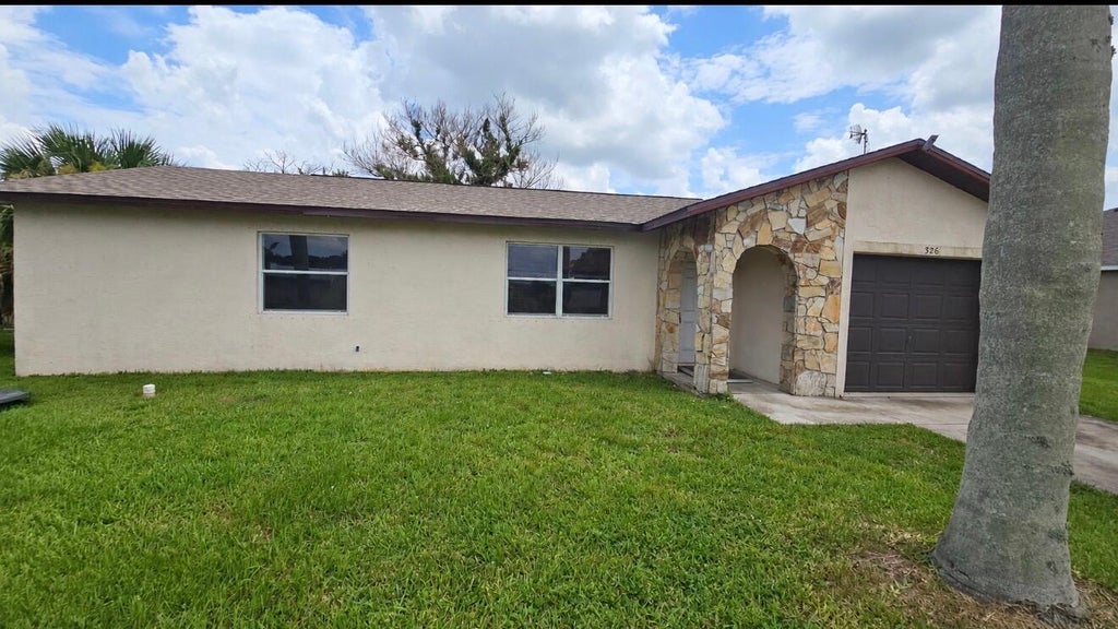 Photo of 326 SE Dalva Avenue, Port Saint Lucie, FL 34984 (MLS # B26079413)