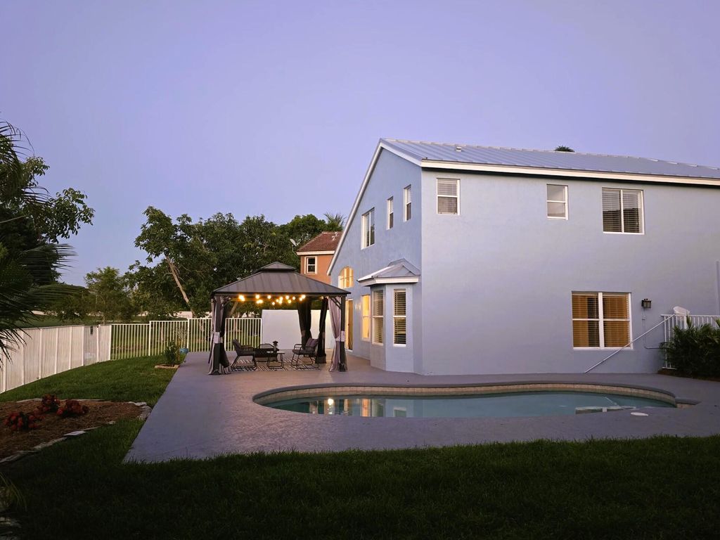 Photo of 8225 Pelican Harbour Drive, Lake Worth, FL 33467 (MLS # R11109697)