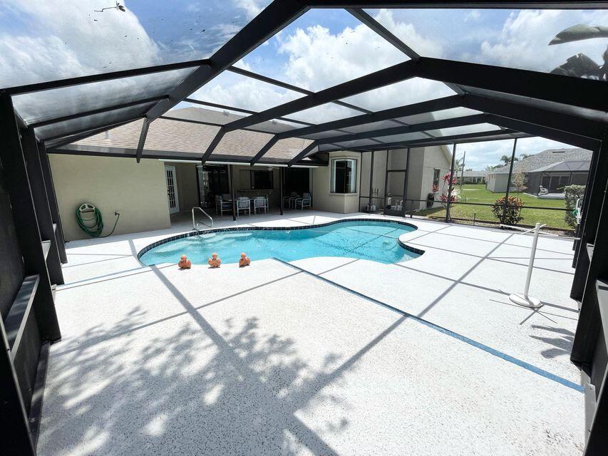 Affordable Pool Home with 3 Bedroom 2 and a half Bath features a large back yard with shed, screened pool area, split bedrooms, cabana bath, separate formal living area and additional family room. Located within 1 mile of the C-24 canal park and boat ramps.