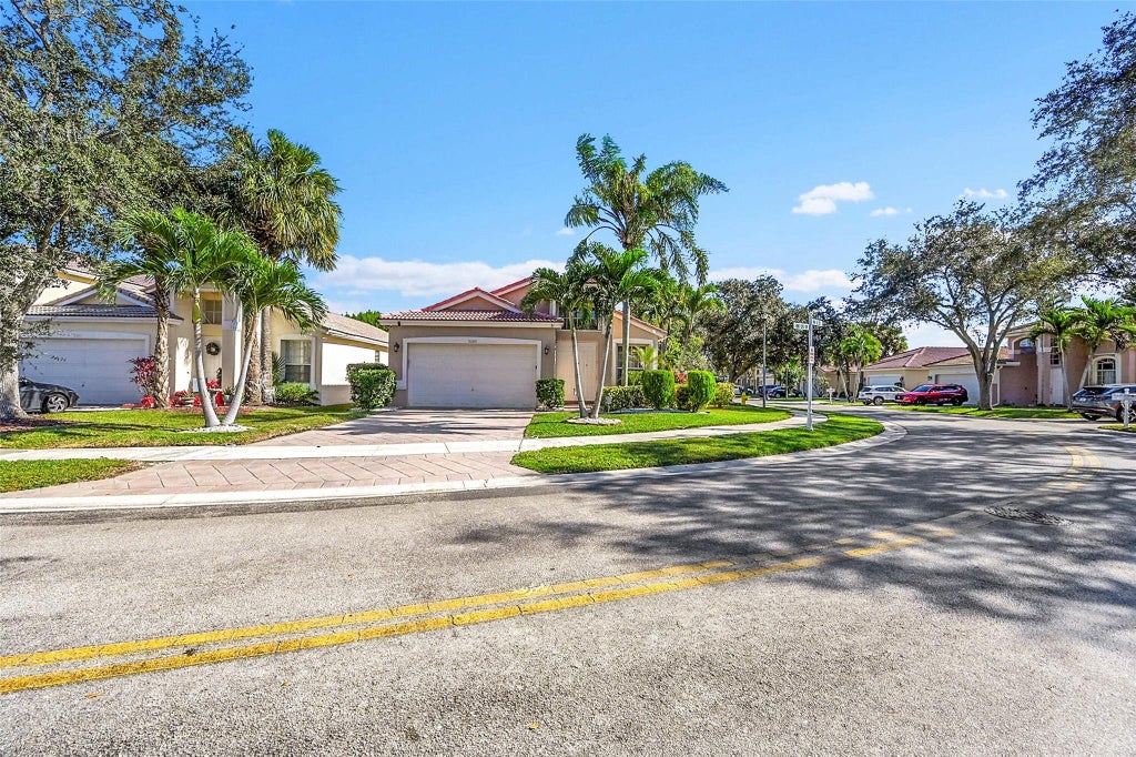 Photo of 5305 NW 126th Drive, Coral Springs, FL 33076 (MLS # F10540777)