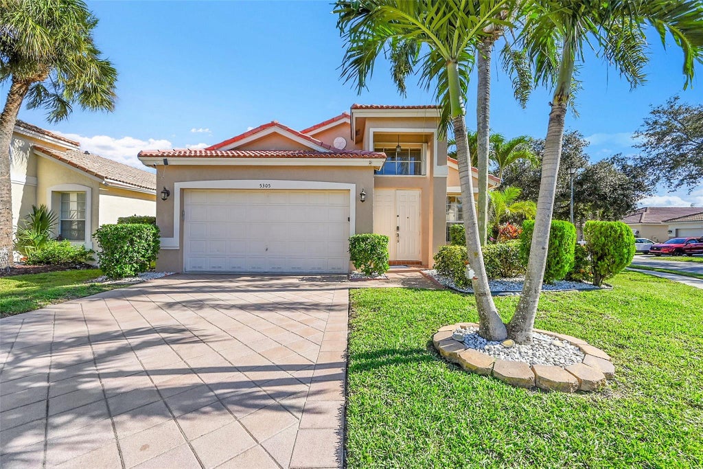 Photo of 5305 NW 126th Drive, Coral Springs, FL 33076 (MLS # F10540777)