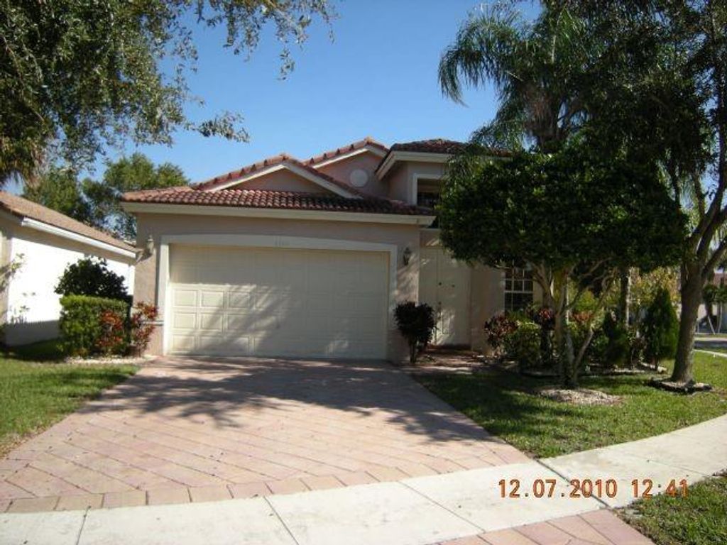 Photo of 5305 NW 126th Dr, Coral Springs, FL 33076 (MLS # F10540777)