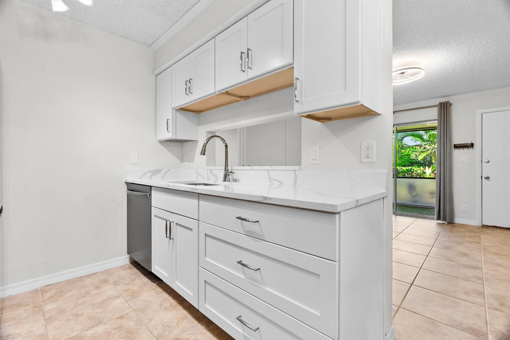 BEST DEAL in Jupiter! Beautifully Renovated 2 Bed, 2 Bath Condo with Premium Upgrades + Designer Touches.Don't miss this incredible opportunity to own a fully upgraded, move-in-ready 2 bedroom, 2 bathroom condo in one of Jupiter's most convenient and sought-after locations--just 10 minutes to the beach and close to everything!This home has been tastefully renovated from top to bottom, starting with a brand-new kitchen featuring high-end finishes and a complete line of brand-new appliances. Kitchen Renovation Includes:-Samsung Counter Depth French Door SMART Refrigerator with Power Cool & Power Freeze, Twin Cooling Plus, Wi-Fi connectivity, ice maker, and fingerprint-resistant stainless steel finish-Samsung 3rd Rack Dishwasher with